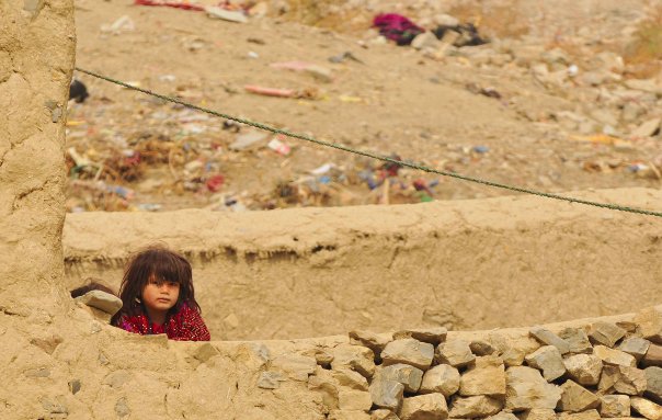 A curious little girl in poverty
