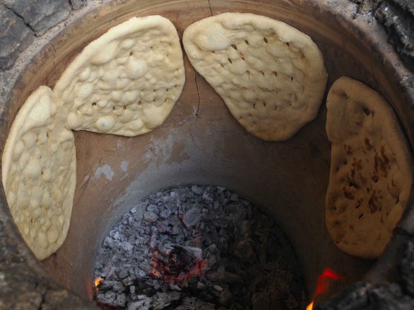 The clay oven where he sticks the bread to the wal
